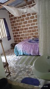 מיטה או מיטות בחדר ב-Chez Bethy Jungle et Océan