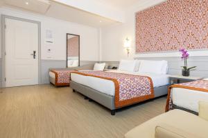 Tempat tidur dalam kamar di Hotel Della Conciliazione