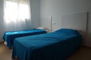 Un pat sau paturi într-o cameră la Condado De Alhama Apt-Pool-Park-Parking-Sleeps4