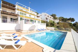 a villa with a swimming pool and a resort at Collmar by Sonne Villas in Cala Galdana