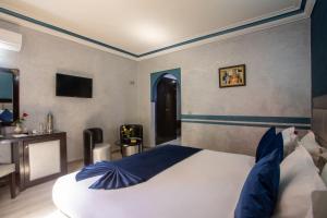 Postel nebo postele na pokoji v ubytování Hotel Meriem Marrakech