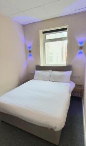 Ένα ή περισσότερα κρεβάτια σε δωμάτιο στο Charlton Aparthotel