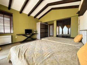 A bed or beds in a room at Private Villa at BlackSeaRama Golf & Villas Resort