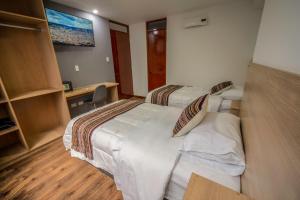 Katil atau katil-katil dalam bilik di Ayni Cusco Hotel