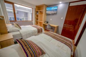 Katil atau katil-katil dalam bilik di Ayni Cusco Hotel