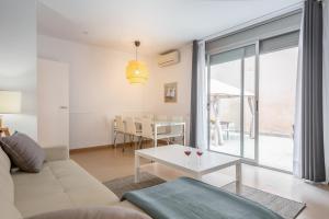 a living room with a couch and a table at Inside Barcelona Apartments Salva in Barcelona