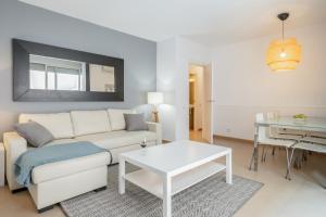 a living room with a couch and a table at Inside Barcelona Apartments Salva in Barcelona