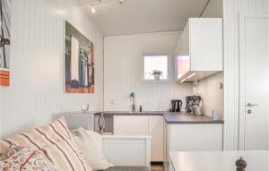 a white kitchen with a sink and a counter at Stunning Apartment In Sölvesborg in Sölvesborg