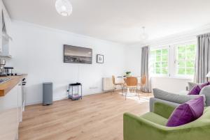 a living room with a couch and a table at Abbey Street - 2 bedroom - Central in St. Andrews