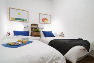 Ein Bett oder Betten in einem Zimmer der Unterkunft Apartamento Plaza Mayor III en Madrid