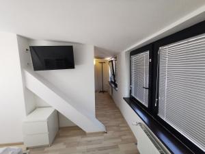 TV a/nebo společenská místnost v ubytování Rooms Ambrožič
