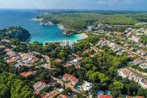 an aerial view of a city and the ocean at Villa Ohana by Sonne Villas in Cala Galdana