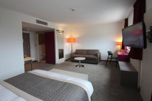 Postel nebo postele na pokoji v ubytování Best Western Colmar Expo