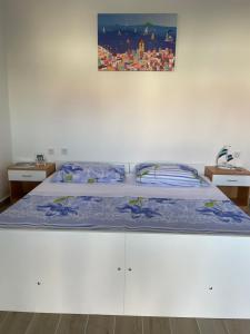 A bed or beds in a room at Apartments Anka Pag
