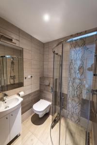 Koupelna v ubytování Apartamenty HELJAN + 34 fotografií