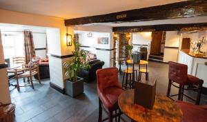 a living room with a table and chairs at The Sun Boutique and Lounge in Hawkshead