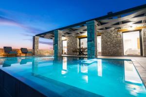 a swimming pool in a villa with a view at Castielia Residence in Agalás