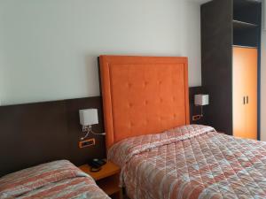 Postel nebo postele na pokoji v ubytování Albergo Casa Este