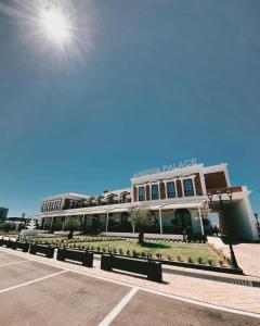 a building with a sign that reads hospital parkaza at Arberia Palace Hotel in Fushë-Milot