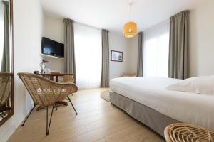 Postel nebo postele na pokoji v ubytování Hotel De Diane