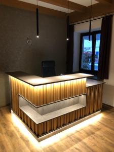 an office with a reception desk with a window at Magali's, Bed & Breakfast - former Pension Andrea in Zell am See