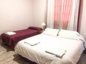 Postel nebo postele na pokoji v ubytování Hotel Mustapic