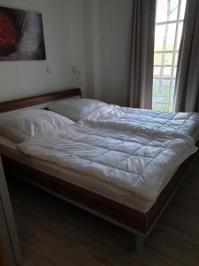 Krevet ili kreveti u jedinici u okviru objekta Ferienwohnung Skipper
