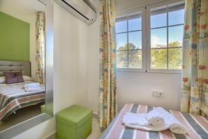 En eller flere senge i et værelse på Villa Benicuco 4 - PlusHolidays