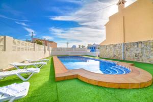 a swimming pool on the roof of a house at Villa Benicolada - PlusHolidays in Calpe