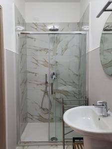 a bathroom with a shower and a sink at B&B La Leggenda in Vieste