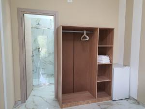 a shower with a glass door in a bathroom at B&B La Leggenda in Vieste
