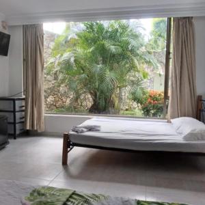 Ένα ή περισσότερα κρεβάτια σε δωμάτιο στο Quinta LF en Melgar