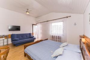 Postel nebo postele na pokoji v ubytování Villa Lukas