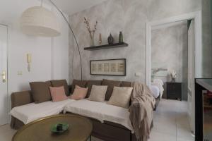 A bed or beds in a room at C32 - Cosy Getaway in the Historical Center of Malaga