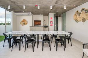 a large dining room with a large table and chairs at A estrenar! Apartamento con pileta zona aeropuerto WIFI 200MG in La Mercedes