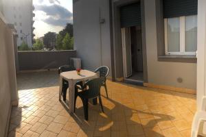 a table and chairs sitting on a patio at Residence Oasi Di Monza in Monza