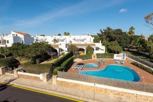 arial view of a house with a swimming pool at Brisa Mar 1, 2 bedroom apartment, Cala'n Bosch in Son Xoriguer