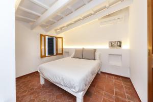 מיטה או מיטות בחדר ב-SANT ISIDRE 50