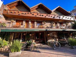 a building with bikes parked in front of it at Hotel Giardino Di Pietra in Gramado