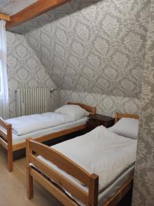 Posteľ alebo postele v izbe v ubytovaní středisko Doubrava