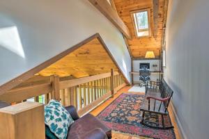 Habitación con escalera, sofá y silla en Spacious Berkshires Retreat about 3 Mi to Skiing!, en Great Barrington