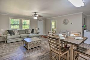 a living room with a couch and a table at Rock Spring Hideaway with Large Yard and Grill! in LaFayette