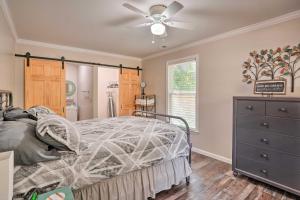 a bedroom with a bed and a ceiling fan at Rock Spring Hideaway with Large Yard and Grill! in LaFayette