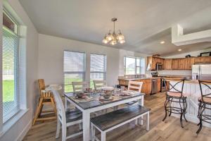 a kitchen and dining room with a table and chairs at Tranquil Indigo Getaway Less Than 3 Mi to Hot Pools! in Lava Hot Springs