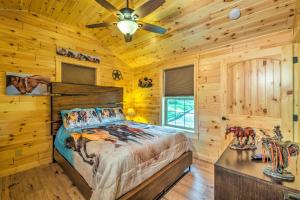 una camera da letto con un letto e un ventilatore a soffitto di Almost Heaven Too 50-Acre Escape with Pond! a Brownsville