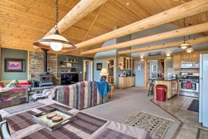 a living room with a couch and a table at Grand Jefferson Home with Stunning Mtn Views! in Bordenville