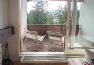 TV a/nebo společenská místnost v ubytování Flat La Riva 111 with pool-Lenzerheide