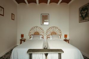 Postel nebo postele na pokoji v ubytování Casa Victoire Ayamonte