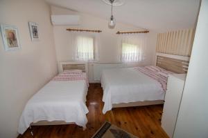 A bed or beds in a room at Villa River Village