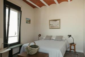 Postel nebo postele na pokoji v ubytování Casa Victoire Ayamonte